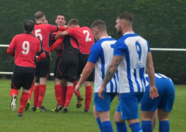 ON A ROLL - Sileby celebrate one of their goals in last weekend's thrashing of Harrowby (Pictures: Dave Ikin)