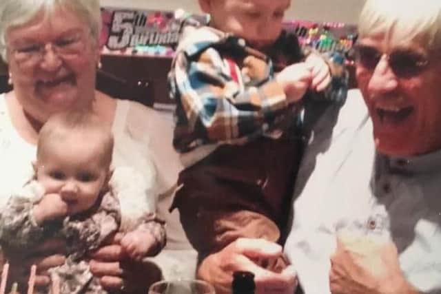 Susan and Bryan with grandchildren Connie and Finley.