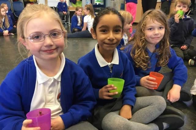 Pupils enjoying a hot chocolate after playing in the snow