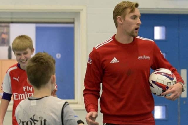 Jack Collison in coaching mode (above) and in action for Wales against England's Frank Lampard (below)