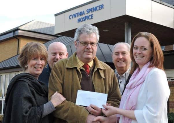 The Caroline Beesley Memorial Handicap Hurdle at Towcester Racecourse in December raised Â£10,000 for the Cynthia Spencer Hospice in N orthampton. Pictured handing over the money to Louise Danielczuk this week are (from left) Sue Bownass, Chris Barritt, Mark Beesley and Mick White