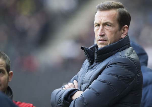 TOUGH START: Justin Edinburgh watches his side during their defeat to MK Dons. Picture by Kirsty Edmonds