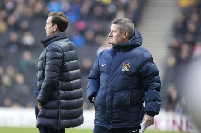 MUCH TO PONDER: Justin Edinburgh and assistant David Kerslake on the touchline during Saturday's defeat to MK Dons. Pictures: Kirsty Edmonds