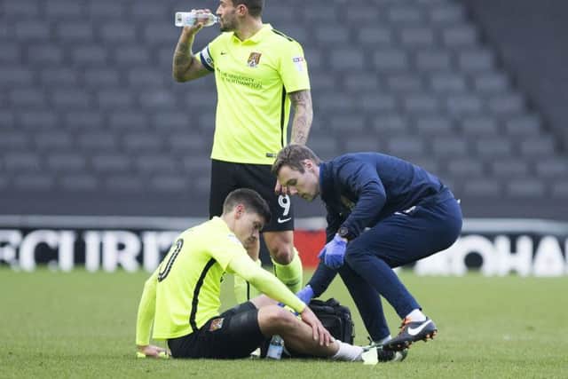 Alex Revell suffered a calf injury during the trip to Milton Keynes Dons (Picture: Kirsty Edmonds)