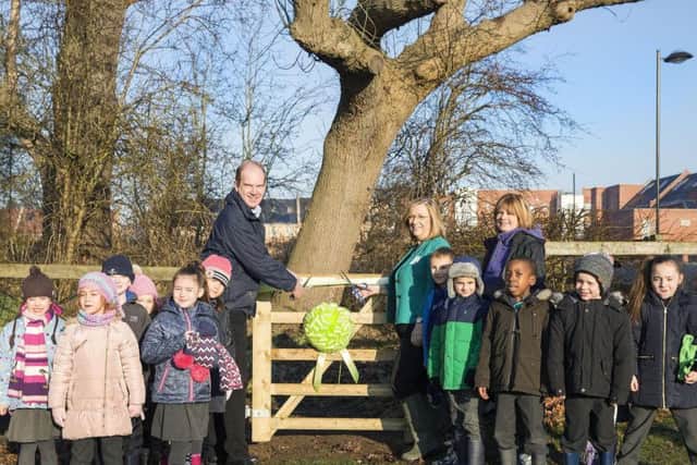 Councillor Jill Hope and the kids of Upton Meadows Primary School open the new forest classroom.