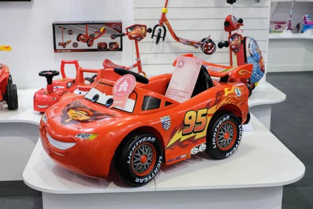 A ride-on replica of Cars' Lightning McQueen has been tipped as one of 2017's top toys - despite costing a whopping £200. The pricey battery-powered car - complete with 'Lightyear' printed wheels - has a maximum speed of just 3km/h. See National News story NNTOY; A ride-on replica of a Disney toy car has been tipped as one of 2017s top toys - despite costing a whopping £200. The pricey battery-powered Cars' Lightning McQueen vehicle - complete with 'Lightyear' printed wheels - has a maximum speed of just 3km/h. Other pricey picks included a wooden 'Forest Cottage', a 40,000 piece Disney Moments puzzle, and a controversial 'hover board' - all at a mind-boggling £400. The toys were on display as part of Britain's biggest toy show, Toy Fair, taking place at Olympia Exhibition Centre in Kensington, west London.
