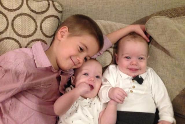 Alex, 5, with twin sister and brother, Katherine and Joshua, 5-months