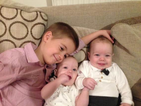 Alex, 5, with twin sister and brother, Katherine and Joshua, 5-months