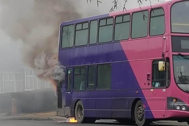 A bus has burst into flames near houses in Northampton