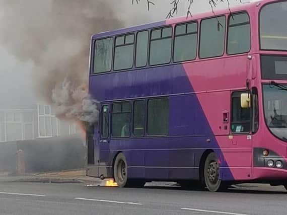 A bus has burst into flames near houses in Northampton