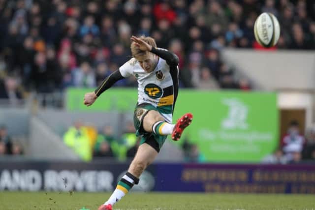 Sam Olver kicks for goal