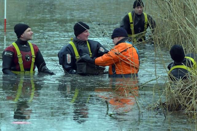 Divers search Eastfield Park Lake in Northampton as part of the investigation into the murder of David Brickwood