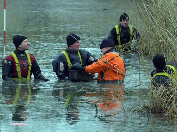 Divers search Eastfield Park Lake in Northampton as part of the investigation into the murder of David Brickwood