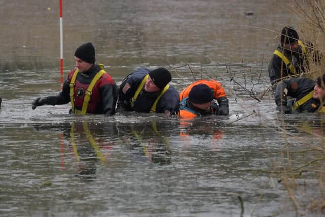 Divers search Eastfield Park Lake in Northampton as part of the investigation into the murder of David Brickwood