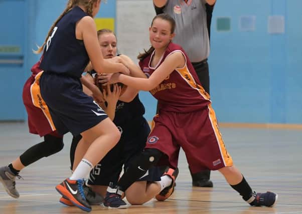 IT'S MINE! - action from the Lightning Under-14 Girls' clash with County Upper Wolves (PIctures: Dave Ikin)