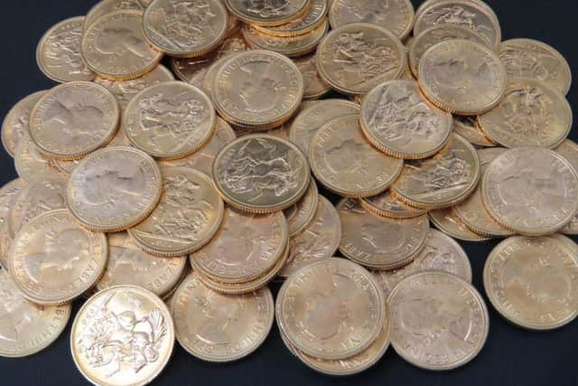 A Towcester woman was given the shock of a lifetime when she found a haul of gold coins in a suitcase worth 35,000.