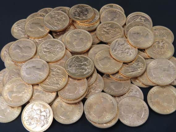 A Towcester woman was given the shock of a lifetime when she found a haul of gold coins in a suitcase worth 35,000.