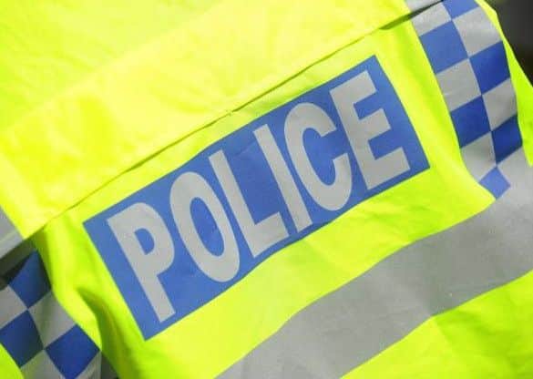 A car has been damaged after yobs threw a large rock off bridge in Northampton