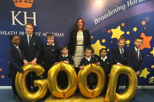 Pupils from King Heath Primary Academy celebrate their rating.