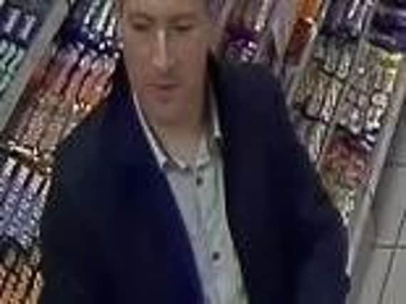 CCTV has been released of a man following theft at Northampton petrol station