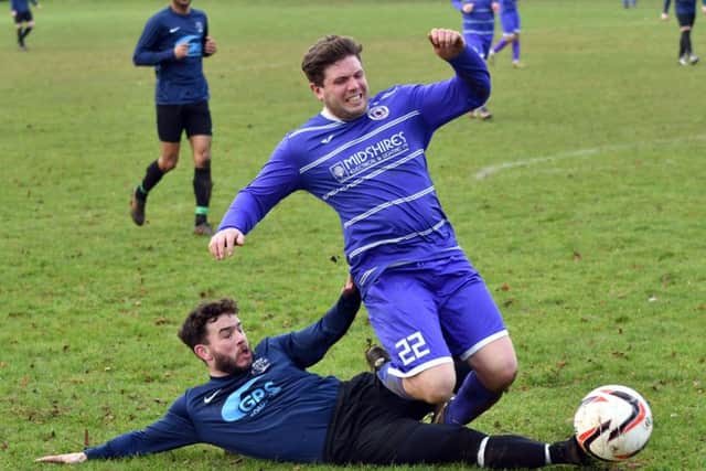 SLIDING IN - action from Midshire Electrical against Sporting Sapphire (Pictures: Dave Ikin)