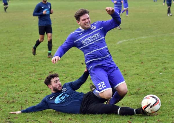 SLIDING IN - action from Midshire Electrical against Sporting Sapphire (Pictures: Dave Ikin)