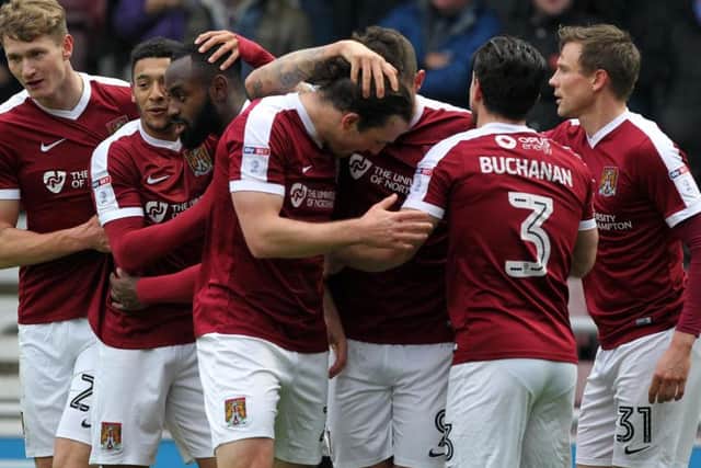 Cobblers players celebrate John-Joe O'Toole's opening goal (Pictures: Sharon Lucey)