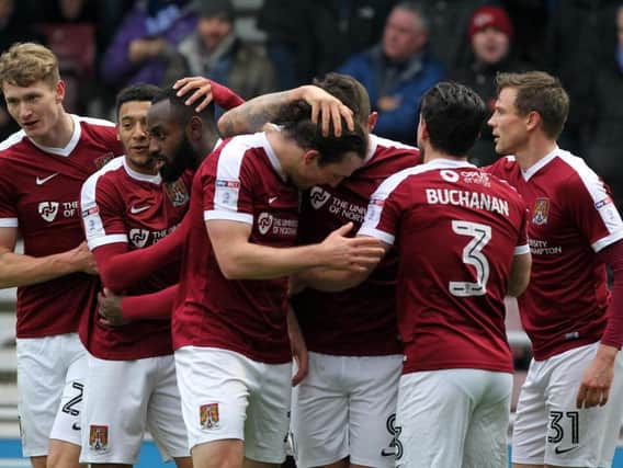 Cobblers players celebrate John-Joe O'Toole's opening goal (Pictures: Sharon Lucey)