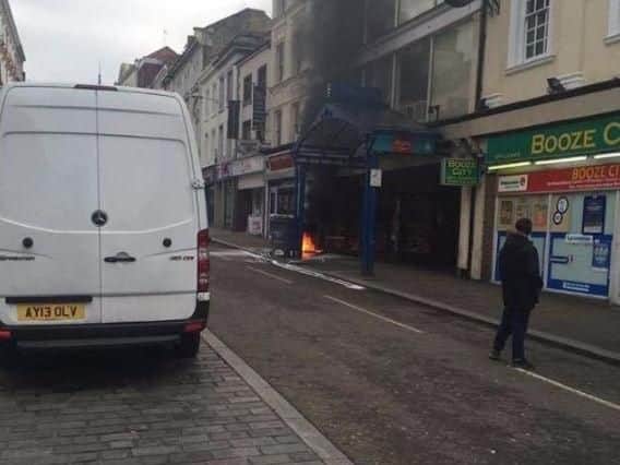 A constant flame erupted from the Gold Street manhole