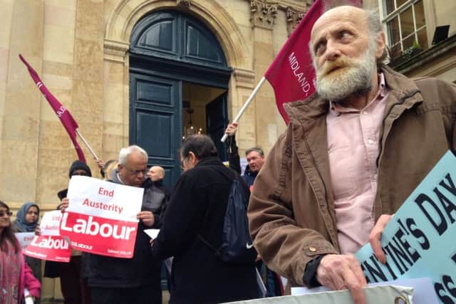 Protesters gathered outside County Hall yesterday ahead of the county council's cabinet meeting.