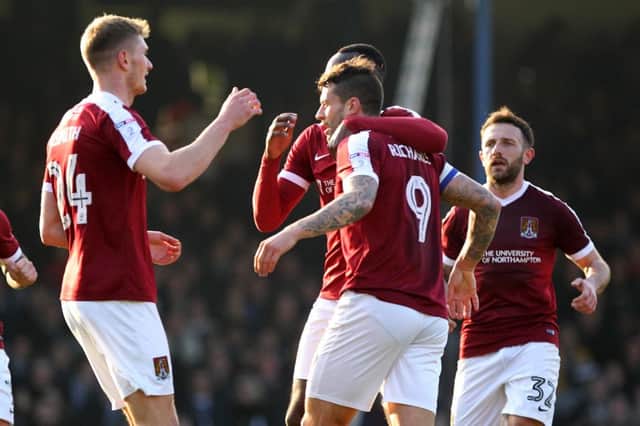 GREAT FINISH: Cobblers celebrate Marc Richards' excellent goal at Southend. Pictures: Sharon Lucey