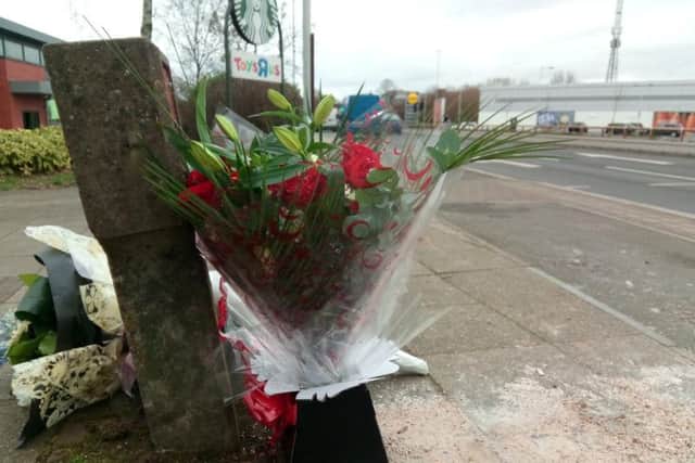 Flowers have been left near the scene of the accident in Towcester Road