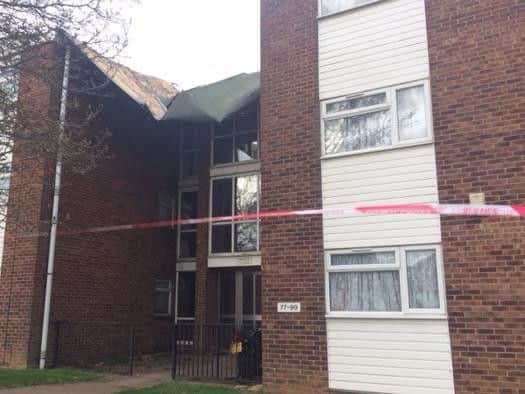 Residents say they heard a loud bang before discovering the roof had come away from their block of flats.