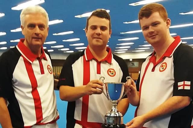 England team manager Andy Thomson with skipper Jamie Walkerand Connor Cinato with the Joyce Trimble Trophy after their win in the British Isles Under 25 International Series