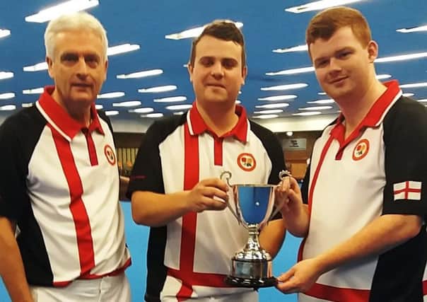 England team manager Andy Thomson with skipper Jamie Walkerand Connor Cinato with the Joyce Trimble Trophy after their win in the British Isles Under 25 International Series