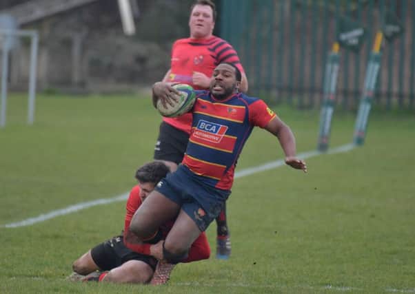 STOPPED IN HIS TRACKS - action from Old Northamptonians' defeat to Newbold (Pictures: Dave Ikin)