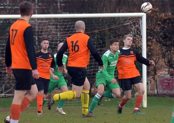 EYES ON THE BALL - action from Spratton's 4-3 premier division win at Earls Barton (Pictures: Dave Ikin)
