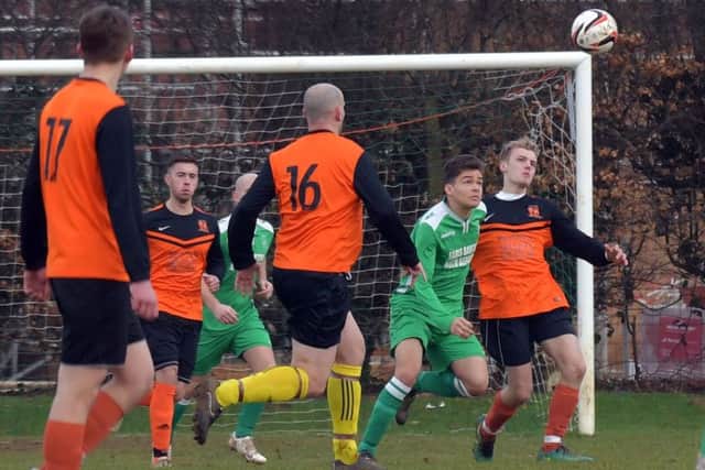 EYES ON THE BALL - action from Spratton's 4-3 premier division win at Earls Barton (Pictures: Dave Ikin)