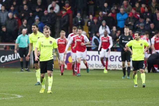 CONTRASTING EMOTIONS: Fleetwood celebrate after inflicting more misery on the Cobblers. Pictures: Kirsty Edmonds