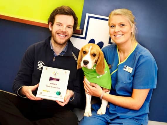 Ed Newbould, head of team engagement and development at White Cross Vets with veterinary nurse Nicola Bond and dog Millie