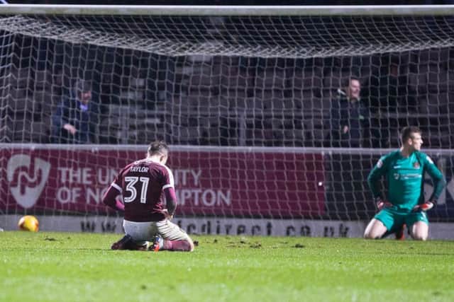 ON THEIR KNEES - Matt Taylor and Adam Smith show their disappointment after Oldham's late winner at Sixfields (Pictures; Kirsty Edmonds)