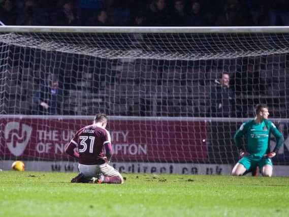 ON THEIR KNEES - Matt Taylor and Adam Smith show their disappointment after Oldham's late winner at Sixfields (Pictures; Kirsty Edmonds)