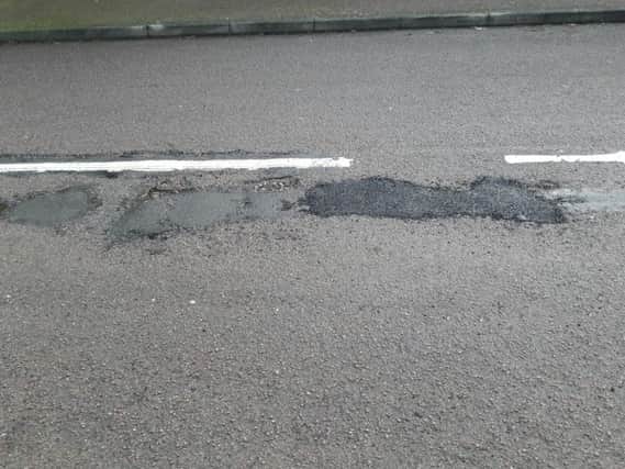 Temporary pothole repairs in Great Billing