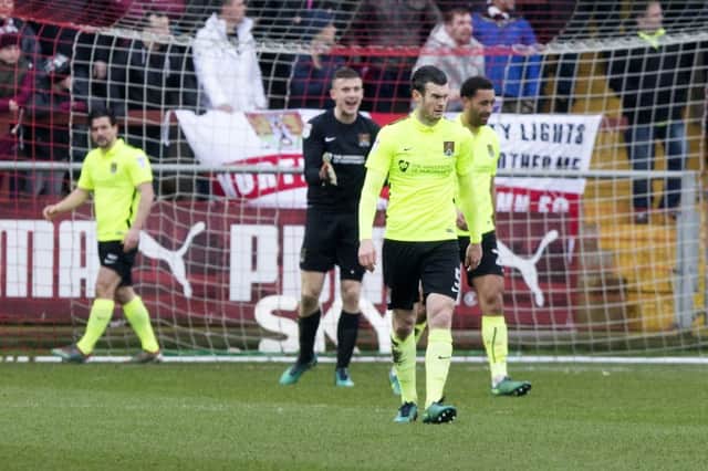 The Cobblers defenders begin the inquest after conceding at Fleetwood