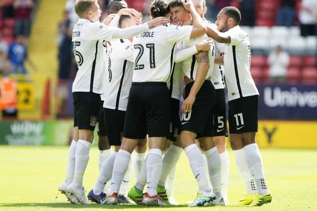 The Cobblers players celebrate Alex Revell's goal in the 1-1 draw at Charlton in August