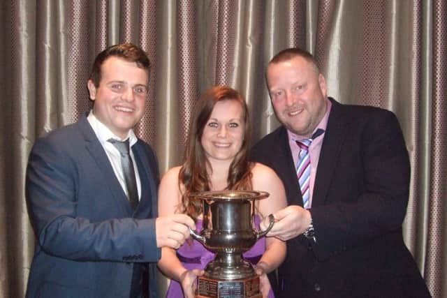 Jamie Walker, Katie Smith and Darren Childs with the National Mixed Fours Champions trophy