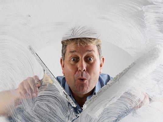 Terry 'Turbo' Burrows, the reigning champion of window washing with a world record of 9.14 seconds.