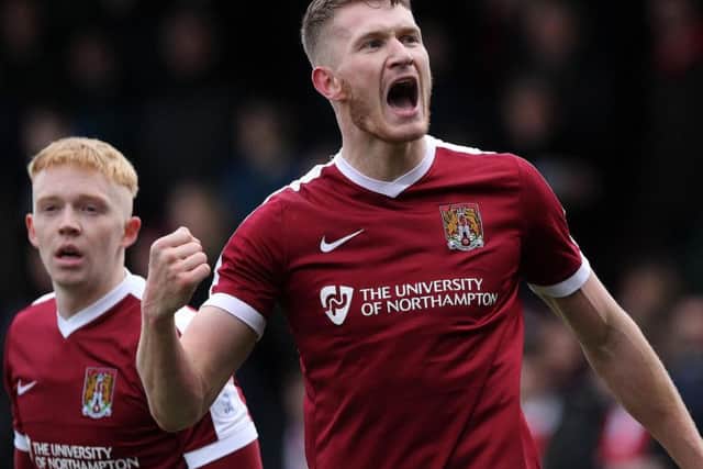 Michael Smith celebrates heading the Cobblers into the lead (Pictures: Sharon Lucey)