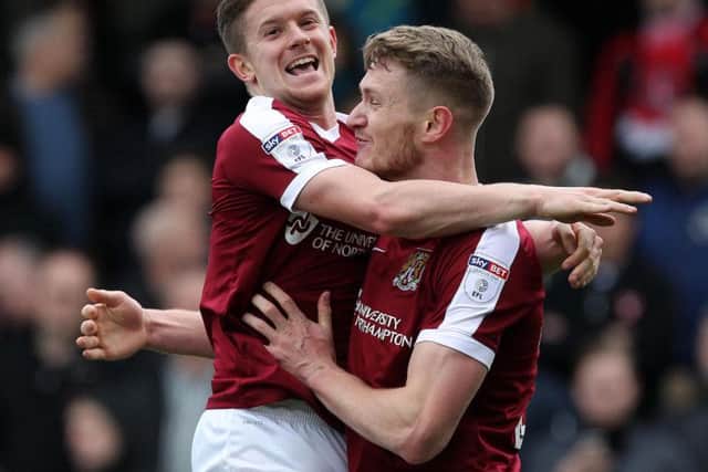 Michael Smith and Aaron Phillips celebrate after the pair combined for the Cobblers' first goal (Pictures: Sharon  Lucey)