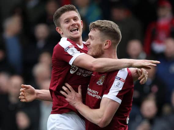 Michael Smith and Aaron Phillips celebrate after the pair combined for the Cobblers' first goal (Pictures: Sharon  Lucey)